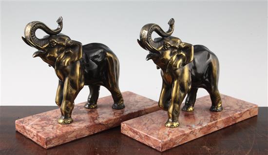 A pair of French bronzed spelter bookends, modelled as elephants, 10in.